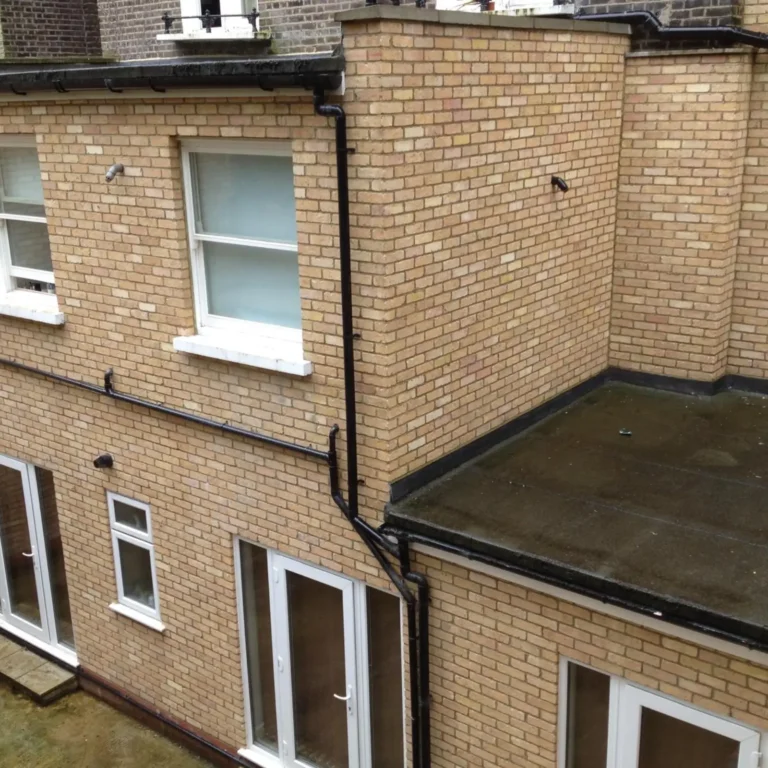 A multi-story brick building in Edgware requiring foundation work.