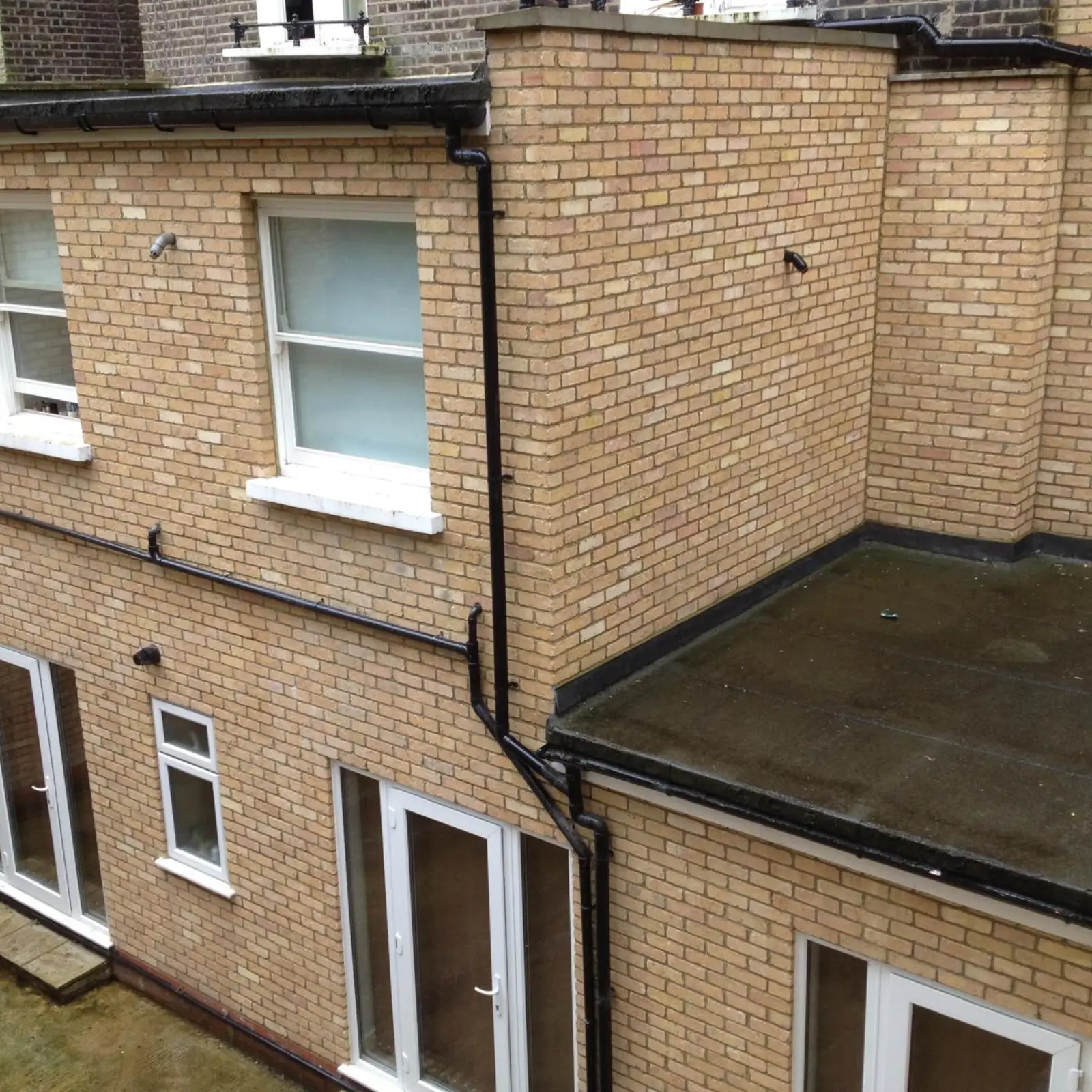 A multi-story brick building in Edgware requiring foundation work.