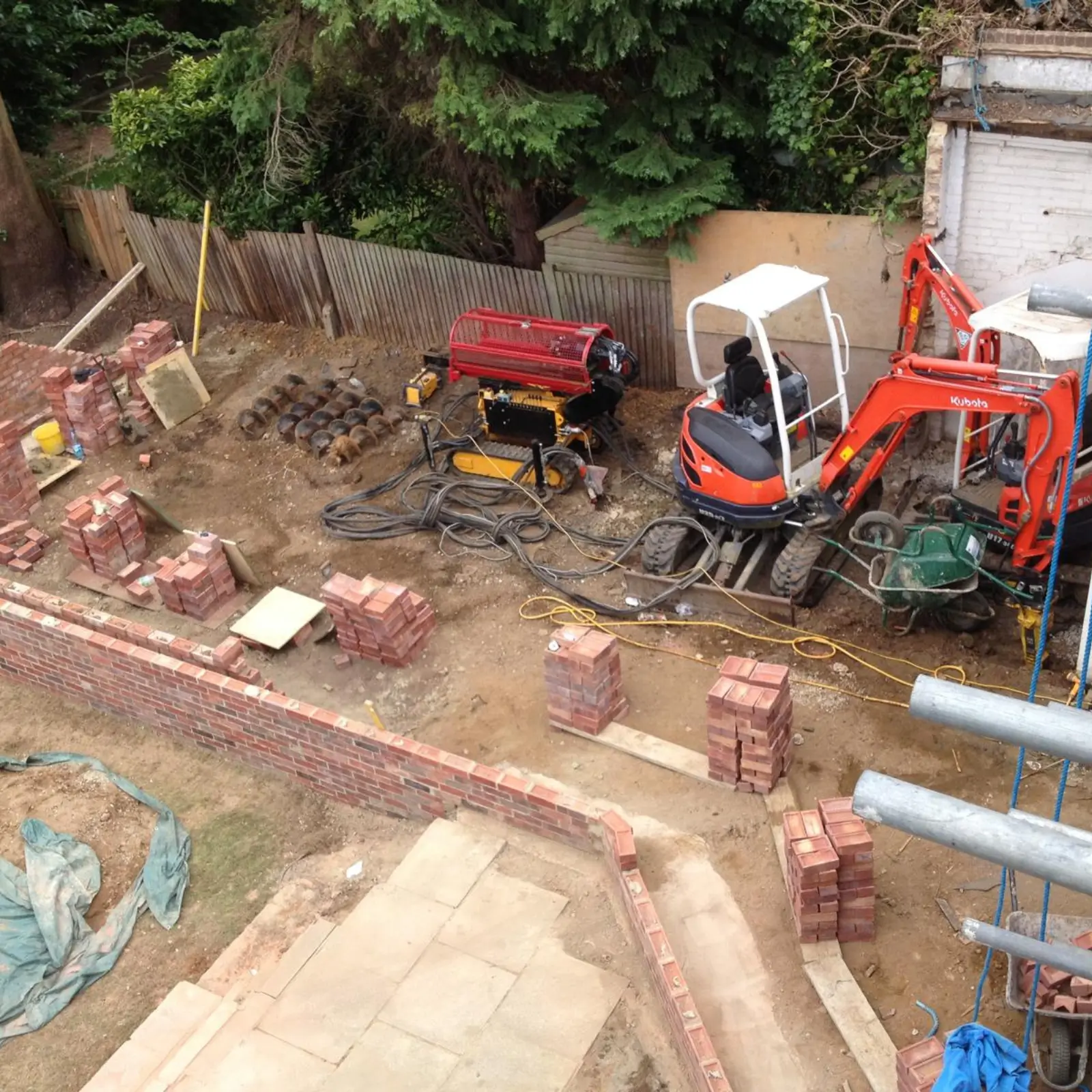 Mini excavator on a foundation site in Elstree.