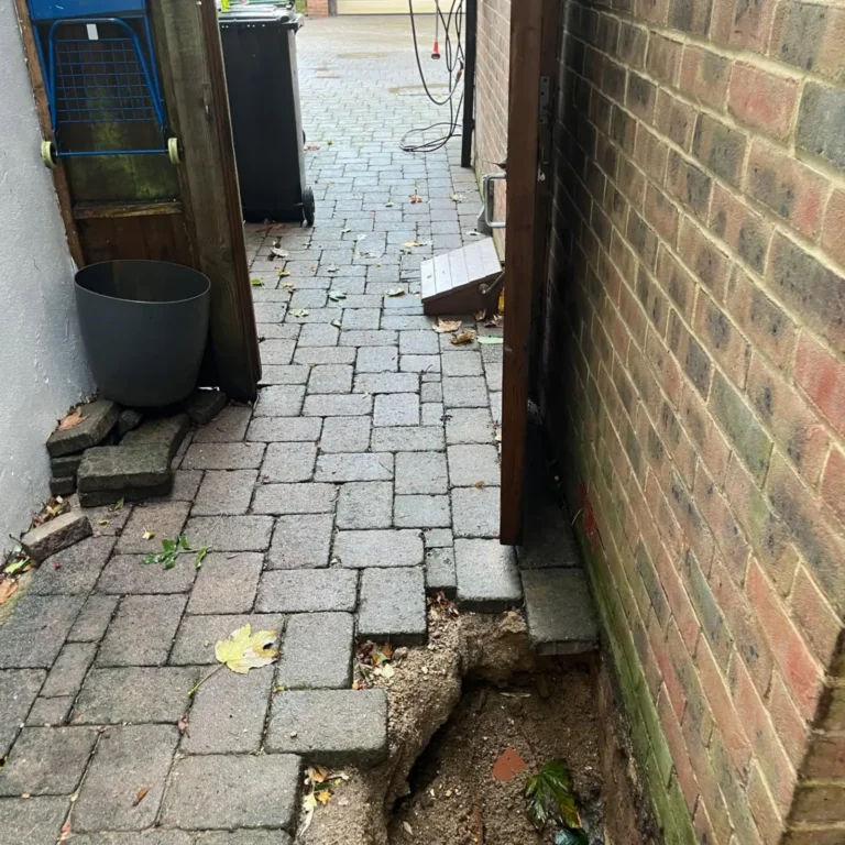 Paving removed for mini piling on a limited access site.
