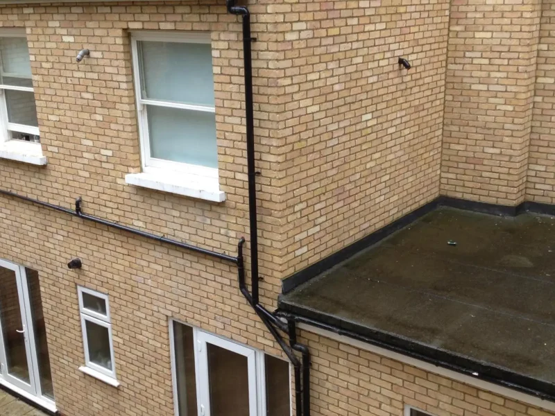 A multi-story brick building in Edgware requiring foundation work.