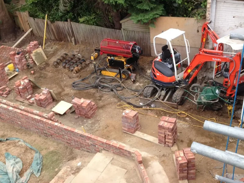 Mini excavator on a foundation site in Elstree.