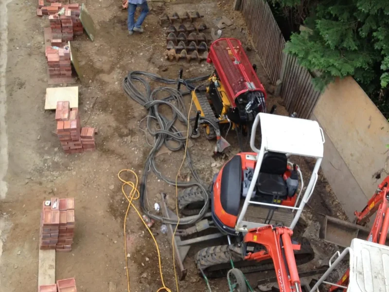 A rotary bored piling rig at work on a large foundation project.
